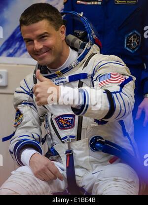 ISS Expedition astronaut Reid Wiseman of NASA is seen during Russian Sokol suit pressure checks in preparation for his launch on the Soyuz rocket to the International Space Station May 29, 2014 at the Baikonur Cosmodrome in Kazakhstan. Suraev, Gerst, and Wiseman will spend the next six months aboard the International Space Station. Stock Photo