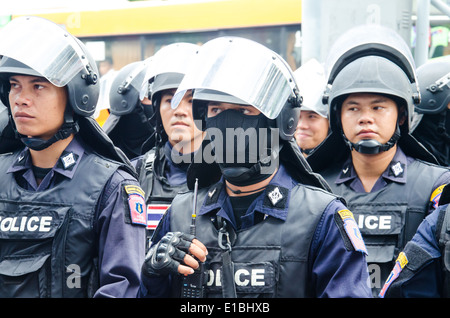 Riot police stand guard during a violent anti-Military coup Stock Photo