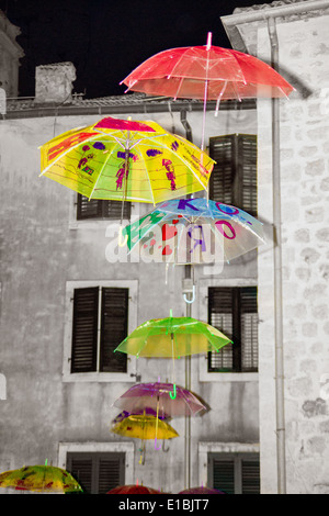 colorful umbrellas flying in the air set on the scene Stock Photo