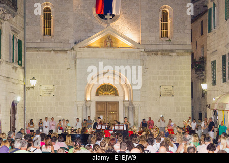 public charity cultural concert in front of the church Stock Photo