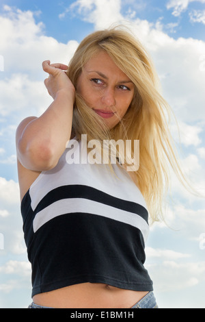 beautiful young blonde woman and sky Stock Photo