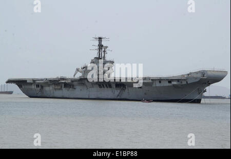 Mumbai, India. 29th May, 2014. INS Vikrant, Indian Navy's first aircraft carrier, is seen moved on the Arabian Sea to a ship breaking yard at Reay Road in Mumbai, India, May 29, 2014. Credit:  Stringer/Xinhua/Alamy Live News Stock Photo