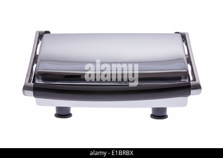 Front view of a closed generic panini machine for grilling and pressing flatbread to make panini sandwiches, isolated on white Stock Photo