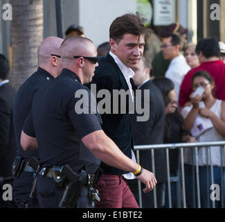 Hollywood, California, USA. 28th May, 2014. Los Angeles Police Officers took a man into custody at Disney's Malificent Movie Premiere on Wednesday evening after he allegedly hit Brad Pitt in the eye while the actor was signing autographs in front of the El Capitan Theatre in Hollywood. Pitt was attending the Malificent premiere with his actress wife Angelina Jolie who stars in the film. It was not clear if Pitt was injured although witnesses stated the actor continued to sign autographs while holding his hand to his eye. © David Bro/ZUMAPRESS.com/Alamy Live News Stock Photo