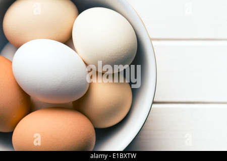 top view of chicken eggs in bowl Stock Photo