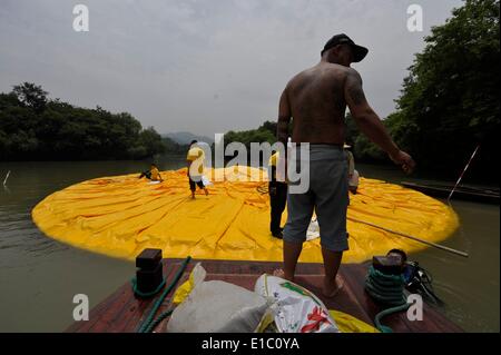 Hangzhou, China. 30th May, 2014. A giant inflatable Rubber Duck designed by Dutch conceptual artist Florentijn Hofman is on display at the Xixi National Wetland Park on May 29, 2014 in Hangzhou, Zhejiang Province of China. Dutch conceptual artist Florentijin Hofman's inflatable Rubber Duck starts a new tours in China again. It will be exhibited in nine mainland cities in China, starting from June 1 in Hangzhou for a month and will takes off to Qingdao then. Credit:  dpa picture alliance/Alamy Live News Stock Photo