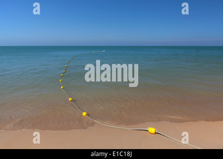 yellow buoy floating on the floating ocean Stock Photo