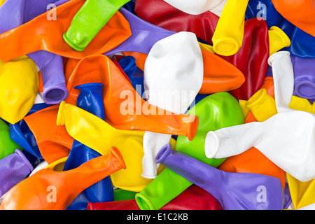 Colorful vibrant background of a pile of deflated party balloons in the colors of the rainbow or spectrum for a festive occasion Stock Photo