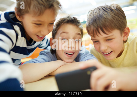 Boys using a new smartphone Stock Photo