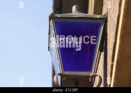Old blue lamp outside police station Stock Photo
