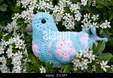 Handmade crocheted toy bird using African Flower Pentagons motifs Stock Photo