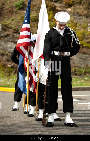 U.S. Sailors assigned to Navy Munitions Command Uraga prepare to parade the colors during a change of command ceremony. Lt. Cmd Stock Photo