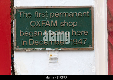 A plaque records the first permanent Oxfam shop on Broad Street in Oxford. Stock Photo