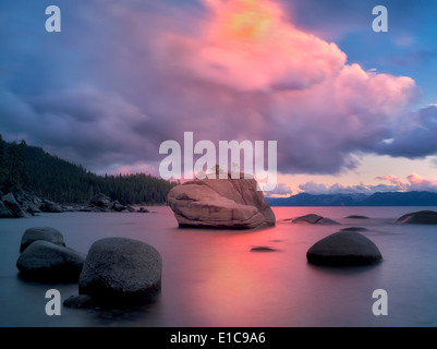 Sunset clouds and granite boulders on east side of Lake Tahoe, Nevada Stock Photo