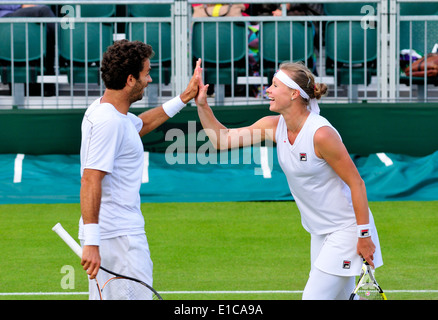 Vera Dushevina (Russia) playing mixed doubles with Jean Julien Royer (France) at Wimbledon 2013 Stock Photo