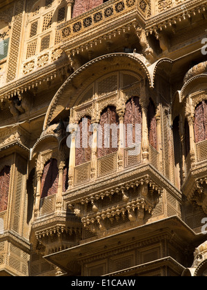 India, Rajasthan, Jaisalmer, Patwon Ki Haveli, decoratively carved sandstone façade, shuttered windows Stock Photo