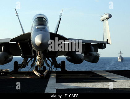 A U.S. Navy EA-18G Growler aircraft attached to Electronic Attack Squadron 141 sits on the flight deck of USS George H.W. Bush Stock Photo