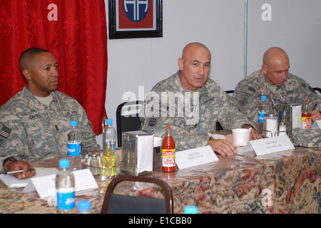 From left, U.S. Army Command Sgt. Maj. Thomas R. Capel, of Combined Joint Task Force - 82 and 82nd Airborne Division, attends a Stock Photo
