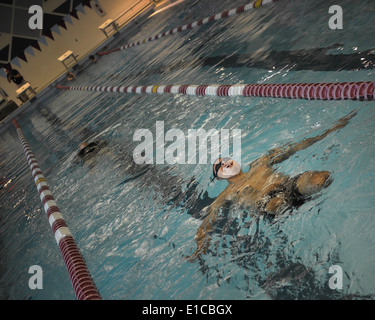 U.S. Marine Corps Corporal Jorge Salazar with Wounded Warrior Battalion West, from Delano, Calif., practice swimming at the 201 Stock Photo