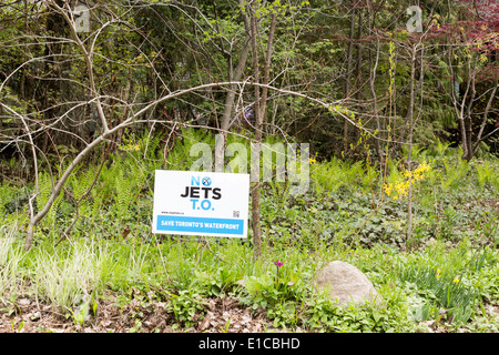 No jets t.o. sign in grass along path on Ward's Island on Toronto Islands protesting the expansion of Billy Bishop Airport. Stock Photo
