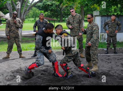 U.S. Marine Corps Sgt. Juan Martinez, second from right, works with a group of Guatemalan navy sailors during a subject matter Stock Photo