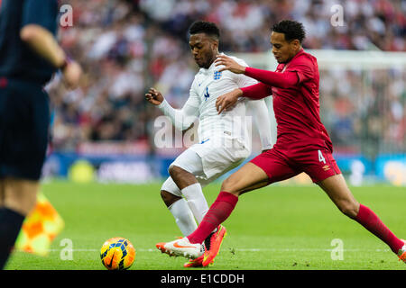 Wembley, UK. 30th May, 2014. England's Daniel STURRIDGE in a challenge with Peru's Alexander CALLENS during the international friendly match between England and Peru at Wembley Stadium. Credit:  Action Plus Sports/Alamy Live News Stock Photo