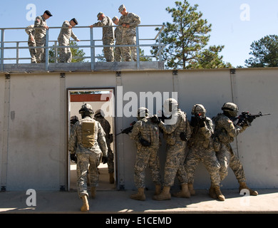 Chief of Staff of the Army Gen. George W. Casey Jr., top second from right, looks through an elevated catwalk as U.S. Soldiers Stock Photo