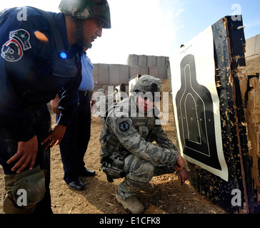 U.S. Air Force Staff Sgt. Michael Gomez, with Detachment 2, 732nd Expeditionary Security Forces Squadron, assesses an Iraqi pol Stock Photo