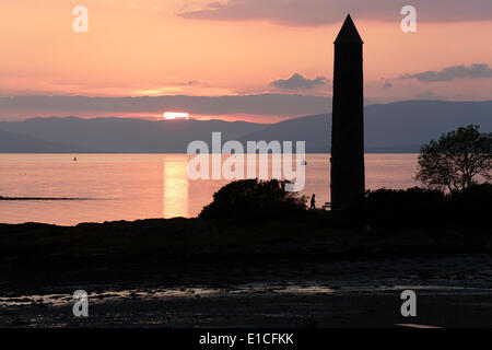 Sunset over the the Firth of Clyde and Pencil Monument in Largs, Scotland, UK Stock Photo