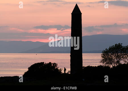 Sunset over the the Firth of Clyde and Pencil Monument in Largs, Scotland, UK Stock Photo