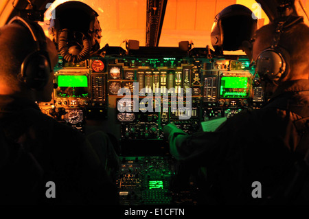 U.S. Air Force Capt. Derek Oakley, left, and Maj. Chris Lovegren, both pilots assigned to the 34th Bomb Squadron, conduct prefl Stock Photo