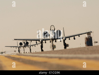 Two U.S. Air Force A-10C Thunderbolt II aircraft from the 354th Expeditionary Fighter Squadron taxi at Kandahar Air Field, Afgh Stock Photo