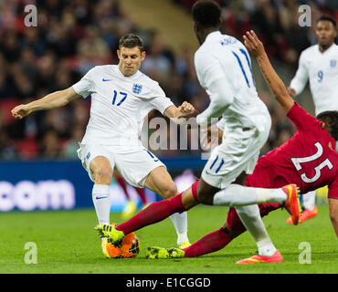 Wembley, UK. 30th May, 2014. England's James MILNER in a challenge with Peru's Hansell RIOJAS during the international friendly match between England and Peru at Wembley Stadium. Credit:  Action Plus Sports/Alamy Live News Stock Photo