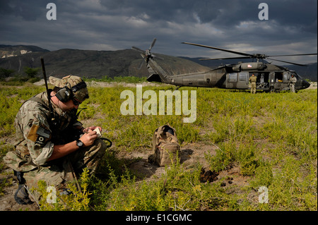 A U.S. Air Force combat controller from the 21st Special Tactics Squadron, Hurlburt Field, Fla., assesses a potential drop zone Stock Photo