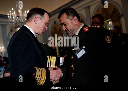 Chairman of the Joint Chiefs of Staff Navy Adm. Mike Mullen greets Afghan Gen. Bismillah Mohammadi Khan, Chief of the General S Stock Photo