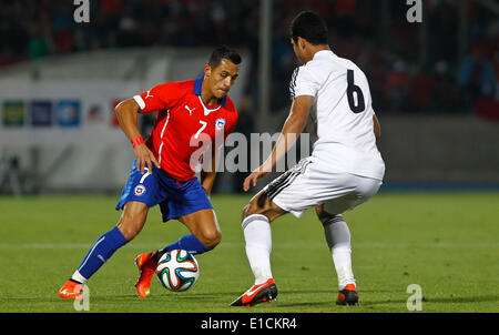 Santiago, Chile. 30th May, 2014. Alexis Sanchez (L) of Chile vies for the ball with Rami Rabia of Eygpt during their international friendly soccer match in Santiago City, capital of Chile, on May 30, 2014. © Stringer/Xinhua/Alamy Live News Stock Photo
