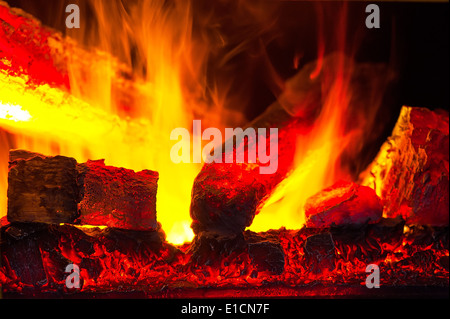 burning down fire logs in macro photography Stock Photo