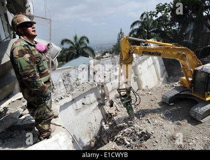 U.S. Navy Gunner's Mate 2nd Class Timothy Gandini, attached to Naval Mobile Construction Battalion 7 out of Gulfport, Miss., sp Stock Photo