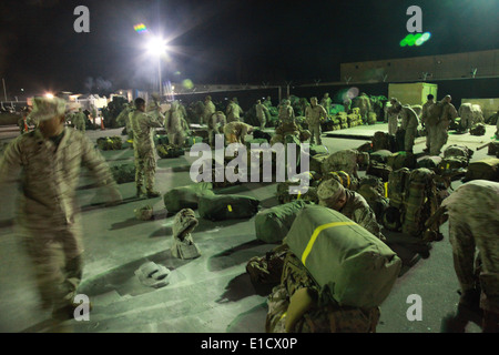 U.S. Marines with Headquarters Battalion, 1st Marine Division (Forward) pack their gear on pallets at Camp Manas, Kyrgyzstan, M Stock Photo