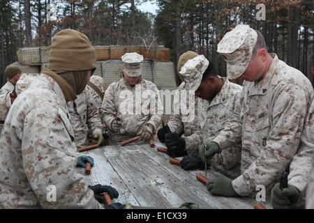 U.S. Marines with Combat Logistics Battalion 26, 26th Marine Expeditionary Unit test fuses prior to a demolition exercise on Ft Stock Photo