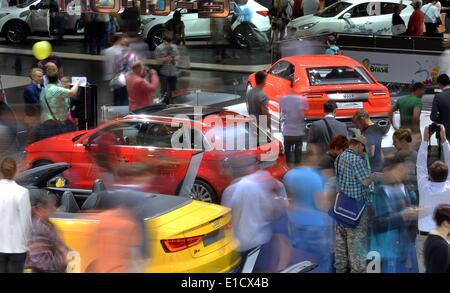 Leipzig, Germany. 31st May, 2014. People visit the Audi booth at the Auto Mobil International 2014 (AMI) in Leipzig, Germany, 31 May 2014. The AMI car show runs from 31 May until 08 June 2014. Photo: HENDRIK SCHMIDT/dpa/Alamy Live News Stock Photo