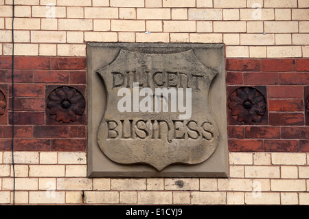 'Diligent in business' plaque, High Street, Lye, West Midlands, England, UK Stock Photo