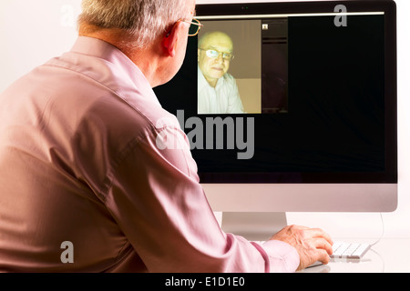 Man at computer on white background Stock Photo