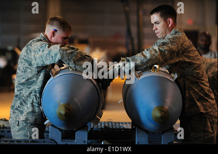 U.S. Air Force Senior Airman Joshua Price, left, and Staff Sgt. Darrell Rinde, both from the 28th Munitions Squadron, build two Stock Photo