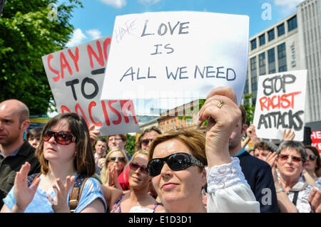 Belfast, Northern Ireland. 31 May 2014 - A woman holds a poster saying 'love is all we need' Credit:  Stephen Barnes/Alamy Live News Stock Photo