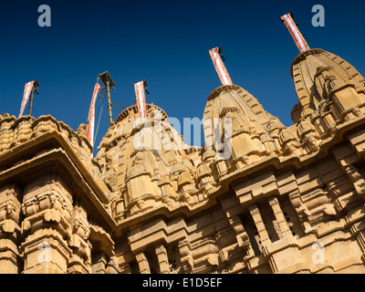 India, Rajasthan, Jaisalmer, Fort, Jain Temple architectural detail of towers against blue sky Stock Photo