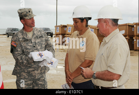 U.S. Army Lt. Col. Chris Eldridge, the chief U.S. military liaison officer in Belize, presents shirts adorned with the U.S. and Stock Photo