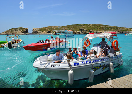 Excursion boats in The Blue Lagoon, Comino (Kemmuna), Gozo Region, Republic of Malta Stock Photo