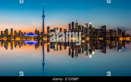 Toronto skyline at dusk, reflected in the Inner Harbor Bay Stock Photo