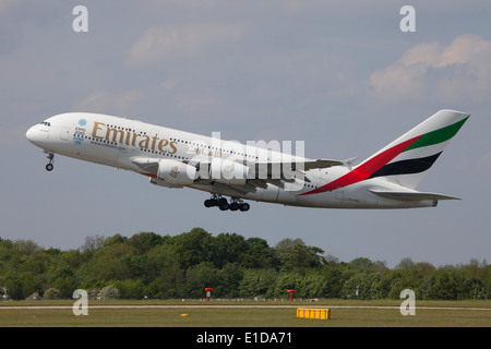 Emirates Airbus A380 double deck, wide body, four-engine jet airliner manufactured by Airbus taking off Stock Photo